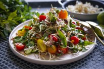 Vietnamese tomato salad with poached chicken and crispy vermicelli. Katrina Meynink Summer one pan recipes for Good Food January 2022. Please credit Katrina Meynink. Good Food use only.