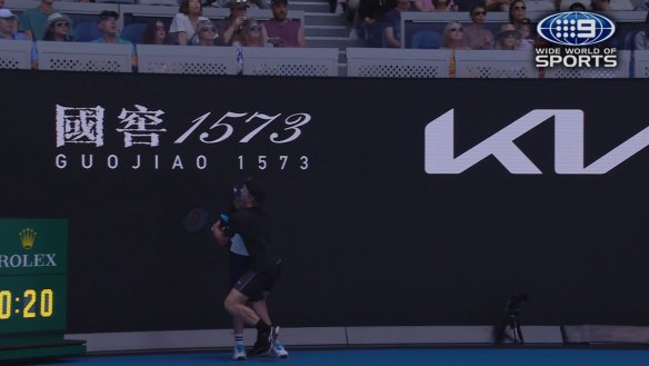 Aussie Dane Sweeny runs into a ballkid on the baseline as he attempts to retrieve a smash.