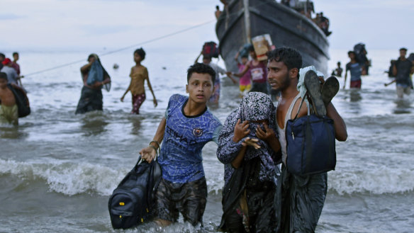 Ethnic Rohingya disembark from their boat upon landing on the north coast of Sumatra, Indonesia, in November.