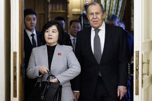 Russian Foreign Minister Sergey Lavrov, right, and North Korean Foreign Minister Choe Son Hui enter a hall for their talks in Moscow, Russia, Tuesday, Jan. 16, 2024