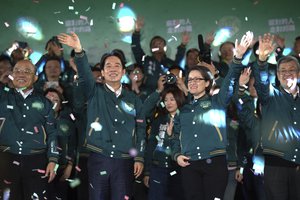 Taiwanese Vice President Lai Ching-te, also known as William Lai, left, celebrates his victory with running mate Bi-khim Hsiao in Taipei, Taiwan, Saturday, Jan. 13, 2024