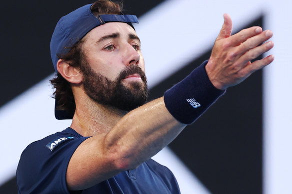 Jordan Thompson has a whinge to the chair umpire about crowd movements during his loss to Stefanos Tsitsipas.