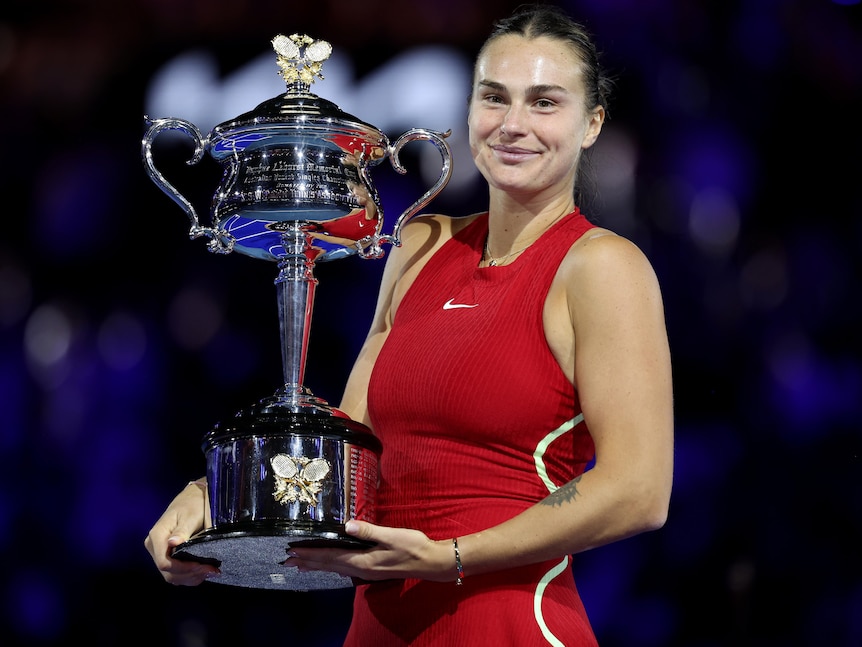 Aryna Sabalenka holds the Australian Open trophy.