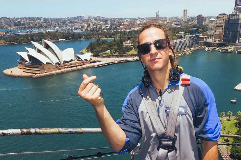 A man climbing the Sydney Harbour Bridge.