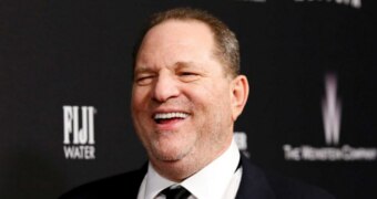 Weinstein laughs on the red carpet of the Golden Globes after party in 2014.