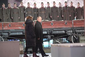 Russian President Vladimir Putin walks as participants dressed in Red Army World War II uniforms take part in a theatrical performance at an open air interactive museum commemorating the 81st anniversary of the World War II-era parade, at Red Square in Moscow, Russia, Tuesday, Nov. 8, 2022.