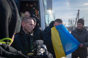 This photograph shared by the Ukrainian President Volodymyr Zelenskyy on the social media platform X on Wednesday, Jan. 31, 2024, shows Ukrainian prisoners of war react after a prisoner exchange at an undisclosed location, Ukraine. Russia and Ukraine have exchanged about 200 prisoners of war each, the countries said Wednesday, despite tensions stemming from last week's crash of a military transport plane that Moscow claimed was carrying Ukrainian POWs and was shot down by Kyiv's forces.