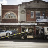 A car being towed from a clearway zone on Sydney Road in Brunswick.