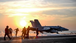 File - ARABIAN GULF (Feb. 5, 2018) An F/A-18E Super Hornet assigned to the Stingers of Strike Fighter Attack Squadron (VFA) 113 launches from the flight deck of the aircraft carrier USS Theodore Roosevelt (CVN 71). Theodore Roosevelt and its carrier strike group are deployed to the U.S. 5th Fleet area of operations in support of maritime security operations to reassure allies and partners and preserve the freedom of navigation and the free flow of commerce in the region.