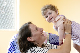 Amy McAuliffe with her daughter Bernadette, 9 months, waited three months for parental leave pay.