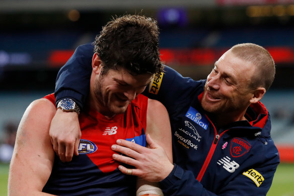 Angus Brayshaw, who has retired from football on medical advice, with coach Simon Goodwin.