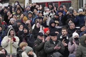 People gather outside the Church of the Icon of the Mother of God Soothe My Sorrows, in Moscow, Russia, Friday, March 1, 2024. Relatives and supporters of Alexei Navalny are bidding farewell to the opposition leader at a funeral in southeastern Moscow, following a battle with authorities over the release of his body after his still-unexplained death in an Arctic penal colony. (AP Photo)