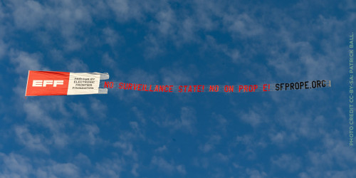 Banner flying over san francisco asking people to vote no on prop E