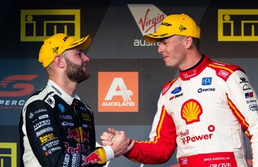 Shane van Gisbergen (left) shakes hands with Scott Mclaughlin in 2019.