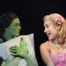 Opposites attract: Elphaba (Sheridan Adams) and Glinda (Courtney Monsma) in <i>Wicked</i>.