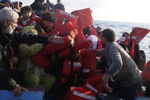 File - Life vests are distributed to migrants as they are being rescued by a MSF (Medecins Sans Frontiers) rescue team boat, after leaving Libya trying to reach European soil, in the Mediterranean Sea, Friday, Oct. 6, 2023.