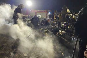 In this photo provided by the Ukrainian Emergency Service, emergency services work at the scene of a building that was damaged by a Russian drone attack in Vinnytsia, Ukraine, Friday, March 15, 2024.