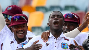 Shamar Joseph celebrates a remarkable Test victory with teammates at the Gabba in January