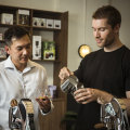 Head barista Matt Coulson talks customer Tin through making his own coffee at Rosso Coffee Experience.