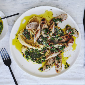 Grilled sausages on a bed of chickpea mash.