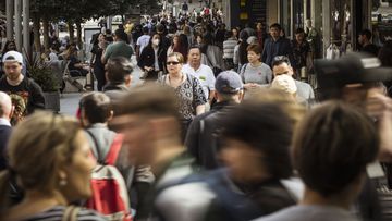 Busy pedestrian foot traffic at Bourke Street Mall, Melbourne.