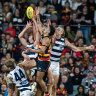 Izak Rankine of the Crows high in the pack over Tom Stewart of the Cats 