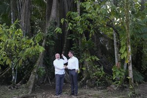 Brazil's President Luiz Inacio Lula da Silva, left, and French President Emmanuel Macron pose for photos on Combu Island, near Belem, Para state, Brazil, Tuesday, March 26, 2024. Macron is on a three-day official visit to Brazil.