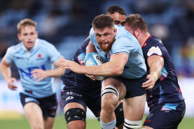 SYDNEY, AUSTRALIA - MARCH 29:  Lachlan Swinton of the Waratahs is tackled during the round six Super Rugby Pacific match between NSW Waratahs and Melbourne Rebels at Allianz Stadium, on March 29, 2024, in Sydney, Australia. (Photo by Matt King/Getty Images)