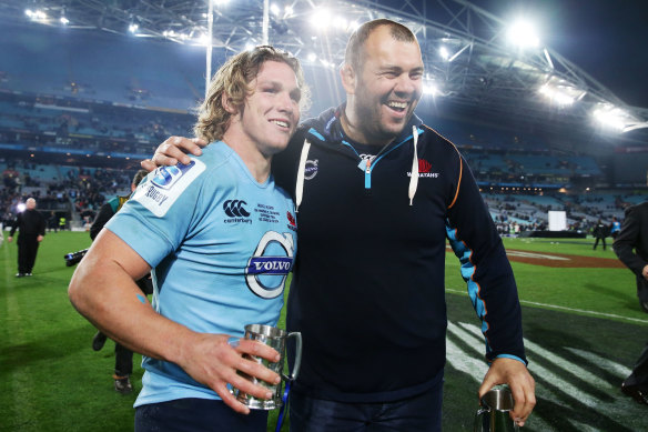 Michael Cheika and Michael Hooper celebrate victory over the Crusaders in the Super Rugby decider in 2014. Is Cheika the man to turn around the waratahs?