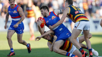 Marcus Bontempelli of the Bulldogs is tackled. Photo by Getty Images.