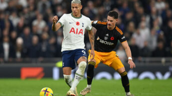 Richarlison of Tottenham Hotspur holds off Robin Koch of Leeds United. Photo by Getty Images.