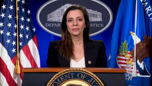 Principal Deputy Assistant Attorney General Nicole M. Argentieri at podium