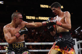 A bloodied Tim Tszyu after catching Sebastian Fundora’s elbow early in their world title bout.