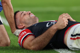 James Tedesco on the ground after copping a knock to the head.