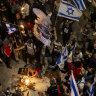 Protesters light a fire during a demonstration calling for a hostages deal and against the Israeli government, Tel Aviv.