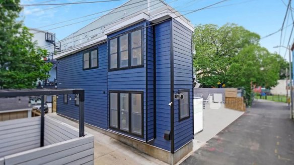 The skinny home is set on a former driveway.