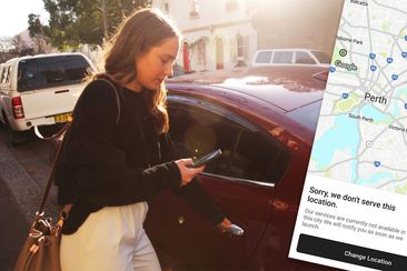 A woman using the Ola rideshare app.