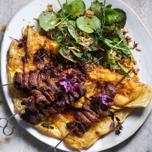 Xinjiang lamb skewers with crispy egg pancakes.