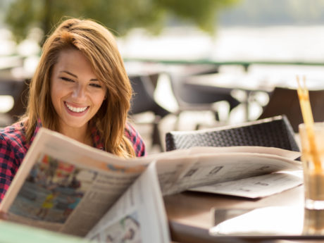 Woman reading newspaper