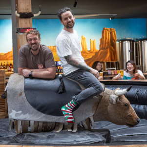 Moon Dog Wild West in Footscray, featuring the mechanical bull ridden by owners Josh Uljans (left) and Karl van Buuren.