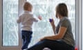 Mother and child are sitting on windowsill