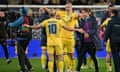 Mykhaylo Mudryk and Maksym Talovierov celebrate after the match between Ukraine and Iceland in Wrocław, Poland.