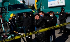 A person reacts as their possessions are seized during a sweep of an encampment in Los Angeles in January 2021. 