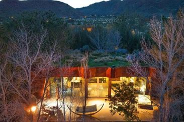 invisible rock house for sale with meadow on roof domain