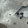 New York Police officers inspect a backpack left at the scene where a man lit himself on fire in a park outside Manhattan criminal court, Friday, April 19, 2024