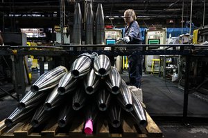 FILE -A steel worker moves a 155 mm M795 artillery projectile during the manufacturing process at the Scranton Army Ammunition Plant in Scranton, Pa., Thursday, April 13, 2023. The Pentagon could get weapons moving to Ukraine within days if Congress passes a long-delayed aid bill. That's because it has a network of storage sites in the U.S. and Europe that already hold the ammunition and air defense components that Kyiv desperately needs. The House approved $61 billion in funding for the war-torn country Saturday, April 20, 2024