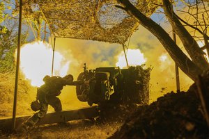 A Ukrainian serviceman of the 10th Assault Brigade Edelweiss fires a D-30 cannon towards Russian positions at the front line, near Bakhmut, Donetsk region, Ukraine, Wednesday, July 5, 2023