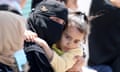 Mourners react as people rebury the bodies of Palestinians killed during Israel's military offensive in Khan Younis.