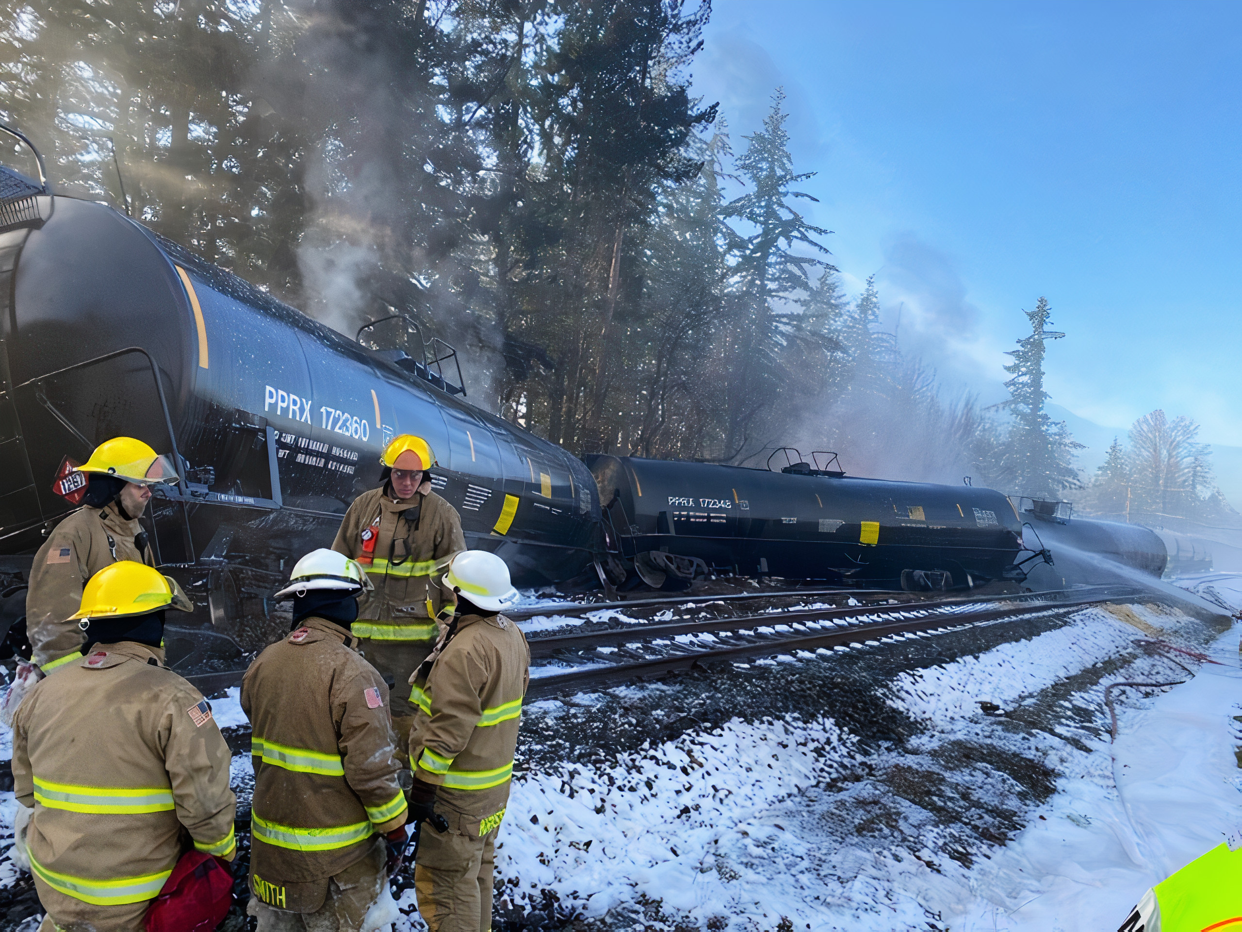 Department of Ecology employees at the site of an oil train derailment