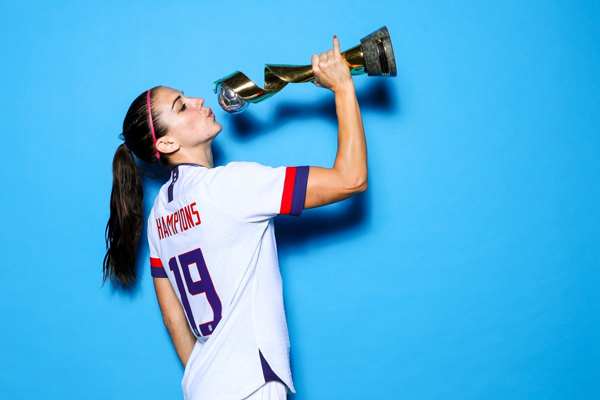 r/photoshopbattles - PsBattle: Alex Morgan 'drinking' from the World Cup, pinky up